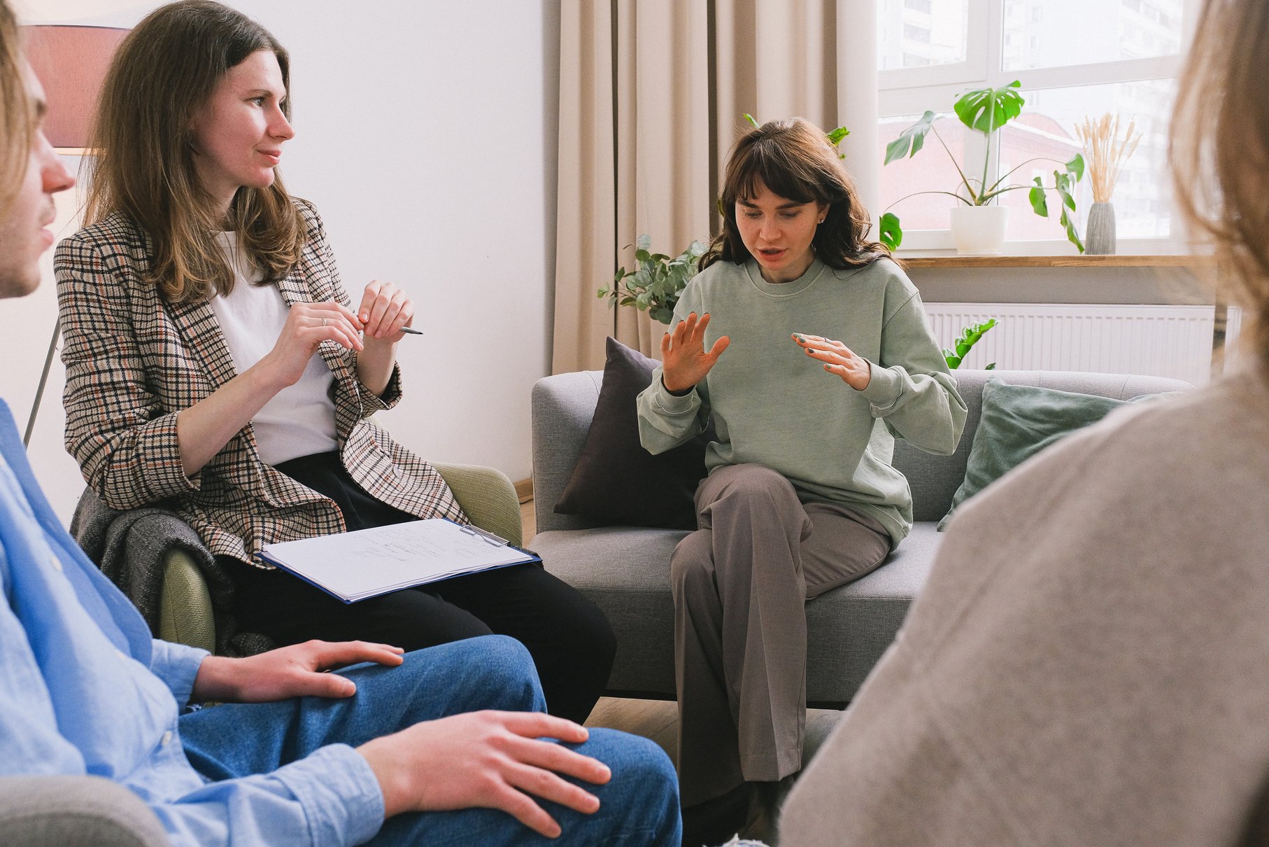 Female explaining problem in group session